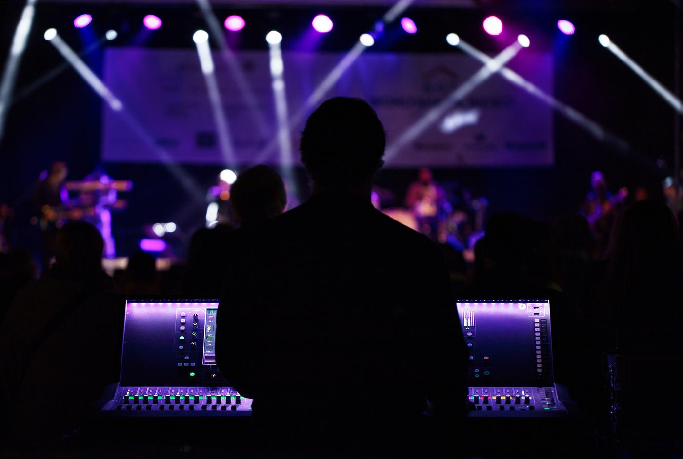 Show lights over a stage, seen from the production desk